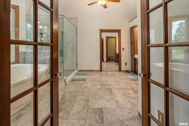 500 Swink Ln, Jonesboro, IL 62952 - hallway featuring french doors, stone tile flooring, baseboards, and vaulted ceiling