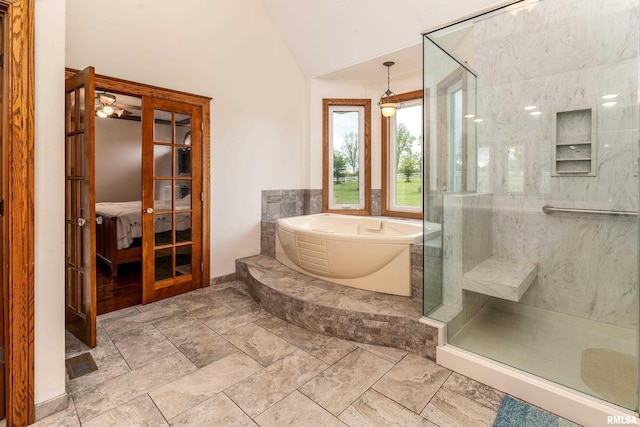 500 Swink Ln, Jonesboro, IL 62952 - bathroom with a stall shower, a garden tub, lofted ceiling, connected bathroom, and baseboards
