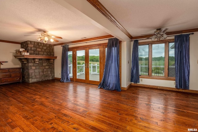 500 Swink Ln, Jonesboro, IL 62952 - unfurnished living room featuring a ceiling fan, a textured ceiling, crown molding, wood-type flooring, and french doors