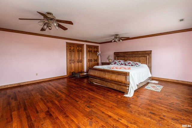 500 Swink Ln, Jonesboro, IL 62952 - bedroom featuring baseboards, hardwood / wood-style flooring, crown molding, a ceiling fan, and a textured ceiling