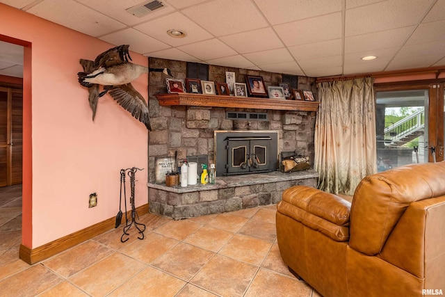 500 Swink Ln, Jonesboro, IL 62952 - living room featuring a drop ceiling, tile patterned flooring, and baseboards