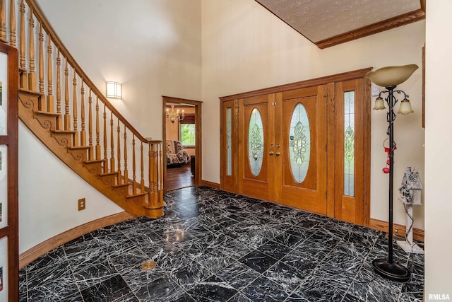 500 Swink Ln, Jonesboro, IL 62952 - entryway with baseboards, stairway, marble look tile flooring, a chandelier, and crown molding
