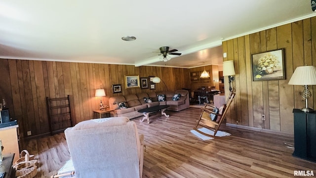 15048 State Highway 14, Benton, IL 62812 - living area with wooden walls, ceiling fan, wood finished floors, and crown molding