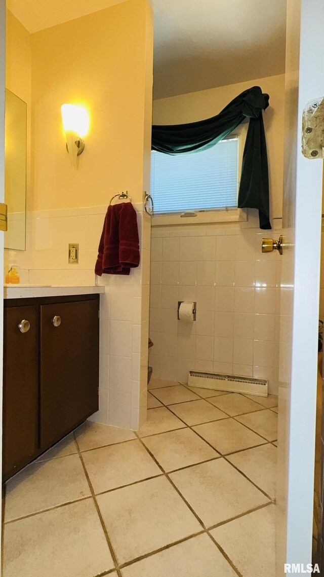 15048 State Highway 14, Benton, IL 62812 - bathroom featuring tile walls, vanity, tile patterned flooring, baseboard heating, and a wainscoted wall