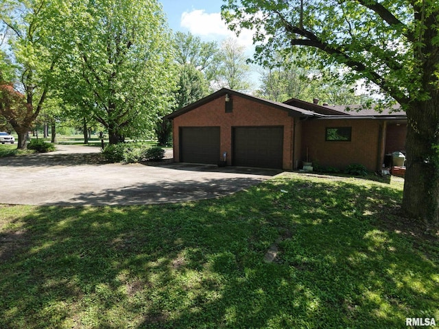 15048 State Highway 14, Benton, IL 62812 - view of front of house with concrete driveway, an attached garage, a front yard, and brick siding