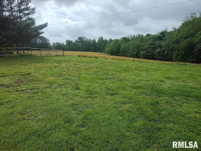 view of yard with a view of rural / pastoral area and a forest view