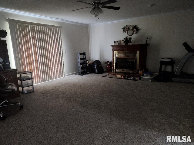 living area featuring ornamental molding, a fireplace, ceiling fan, and carpet flooring