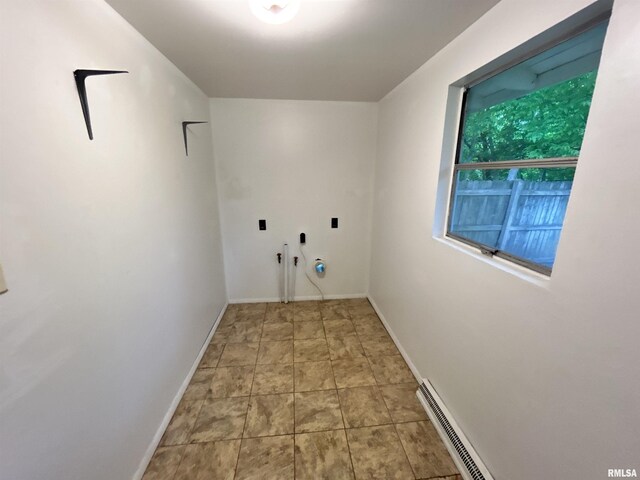104 W Maple St, Cobden, IL 62920 - laundry area with stone finish floors, baseboards, and washer hookup