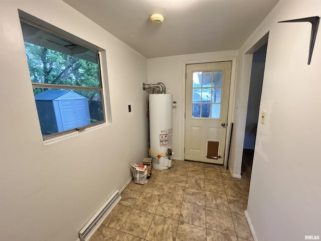 104 W Maple St, Cobden, IL 62920 - doorway to outside featuring gas water heater, healthy amount of natural light, and baseboards