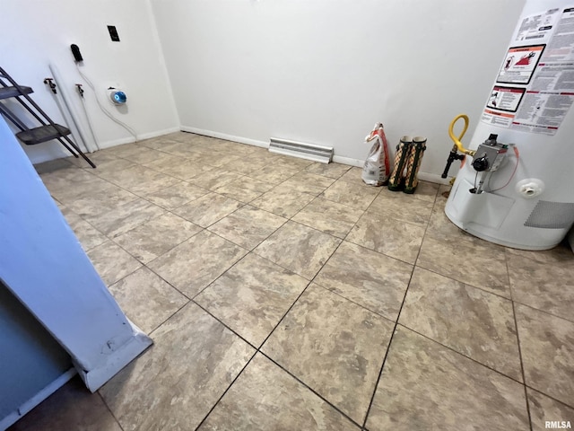 104 W Maple St, Cobden, IL 62920 - laundry area featuring water heater, tile patterned floors, and baseboards