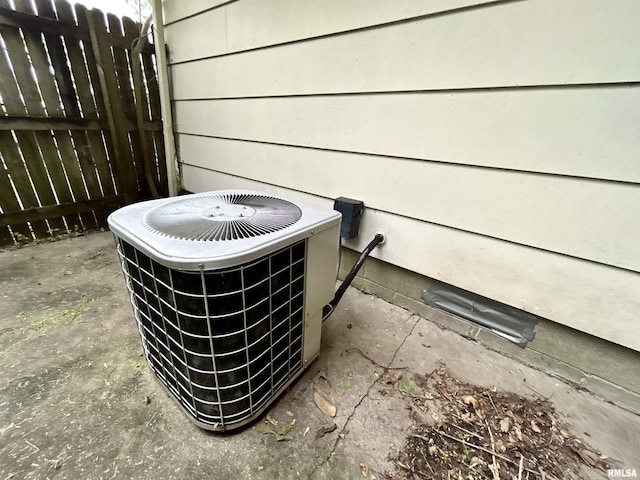 104 W Maple St, Cobden, IL 62920 - exterior view of central air condition unit and fence