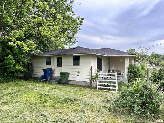 104 W Maple St, Cobden, IL 62920 - rear view of property featuring a lawn and a shingled roof