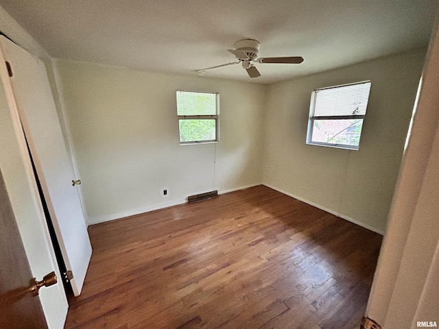 104 W Maple St, Cobden, IL 62920 - unfurnished bedroom featuring wood finished floors, a ceiling fan, and baseboards