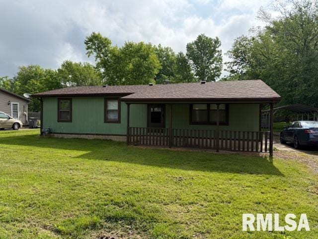 1308 Main St, Carterville, IL 62918 - view of front of home featuring a front yard and a detached carport