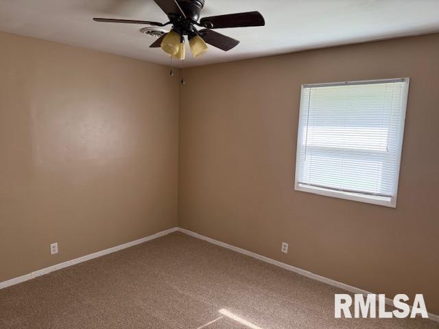1308 Main St, Carterville, IL 62918 - empty room featuring baseboards, carpet flooring, and ceiling fan