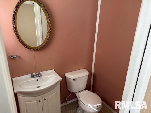 1308 Main St, Carterville, IL 62918 - bathroom featuring baseboards, toilet, vanity, and tile patterned floors