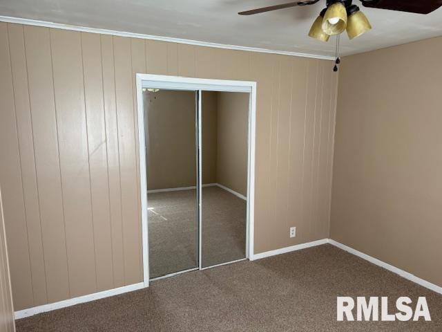 1308 Main St, Carterville, IL 62918 - unfurnished bedroom featuring carpet flooring, a closet, ornamental molding, baseboards, and ceiling fan