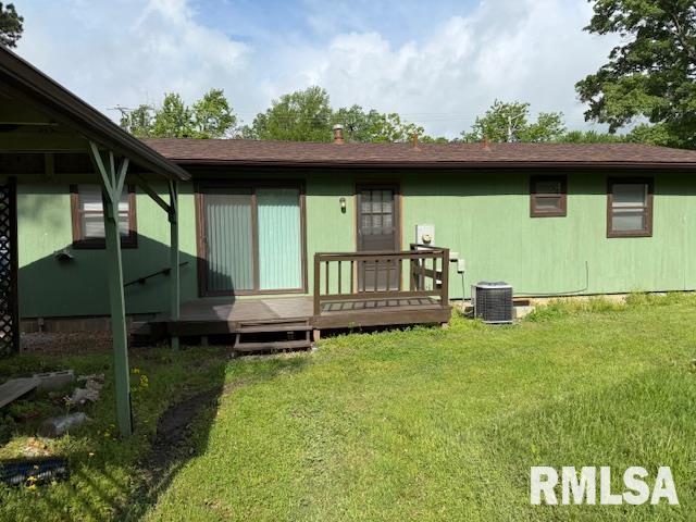 1308 Main St, Carterville, IL 62918 - rear view of property with a deck, a yard, and central AC