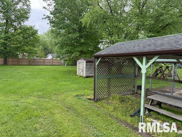 1308 Main St, Carterville, IL 62918 - view of yard featuring a storage unit and an outbuilding