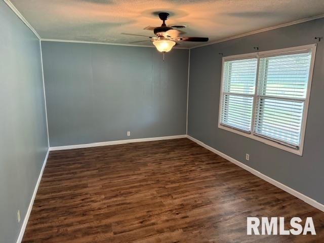 1308 Main St, Carterville, IL 62918 - empty room with ornamental molding, a ceiling fan, dark wood-type flooring, and baseboards