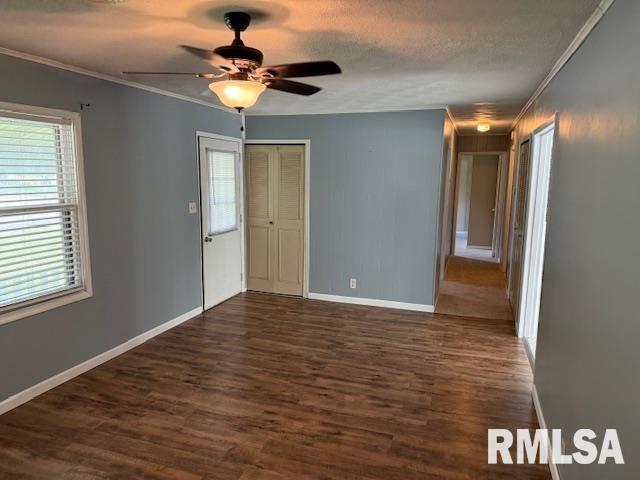 1308 Main St, Carterville, IL 62918 - unfurnished room with crown molding, dark wood finished floors, baseboards, a ceiling fan, and a textured ceiling