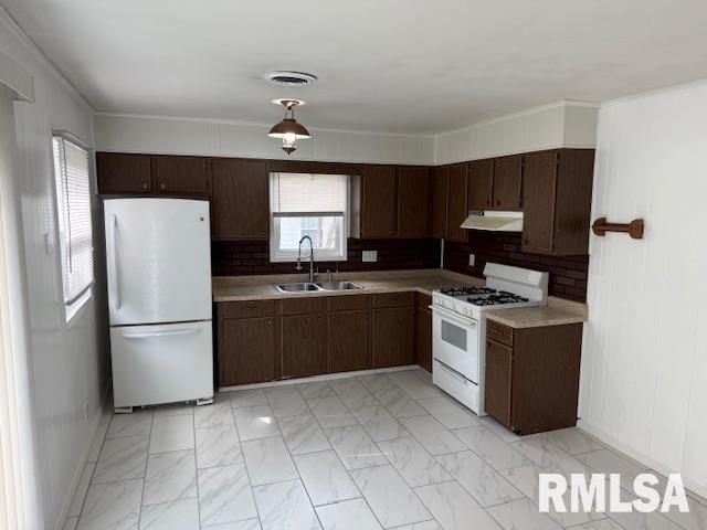 1308 Main St, Carterville, IL 62918 - kitchen with white appliances, a sink, under cabinet range hood, light countertops, and light marble finish floors