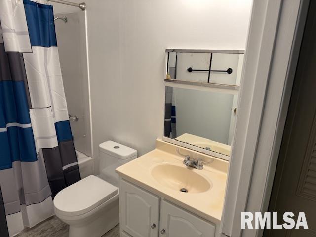 1308 Main St, Carterville, IL 62918 - full bathroom with toilet, vanity, and shower / bath combo with shower curtain