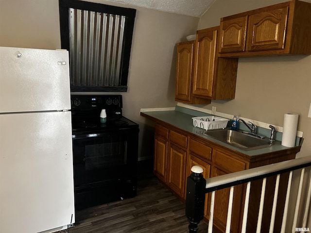 11729 Kevin Ln, Carterville, IL 62918 - kitchen featuring freestanding refrigerator, black range with electric cooktop, a sink, brown cabinetry, and vaulted ceiling