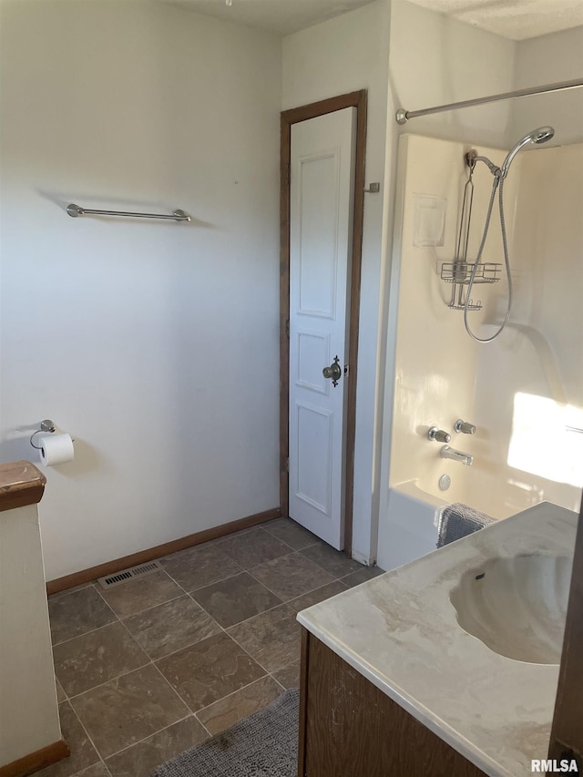 11729 Kevin Ln, Carterville, IL 62918 - full bathroom featuring baseboards, shower / tub combination, and vanity