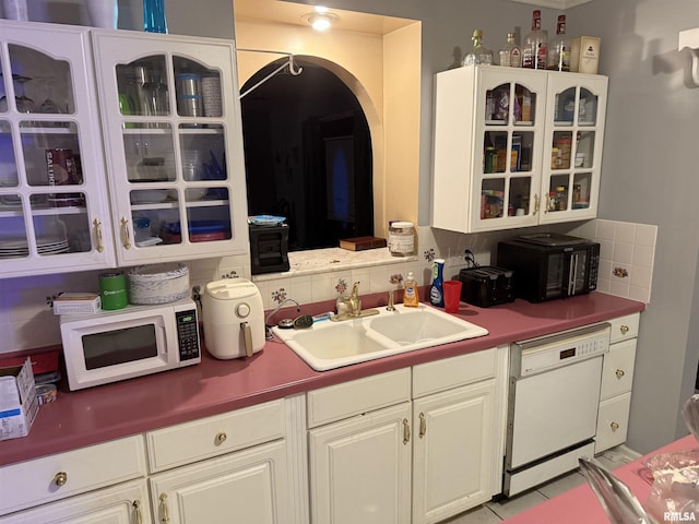 11729 Kevin Ln, Carterville, IL 62918 - kitchen with white appliances, a sink, decorative backsplash, and glass insert cabinets