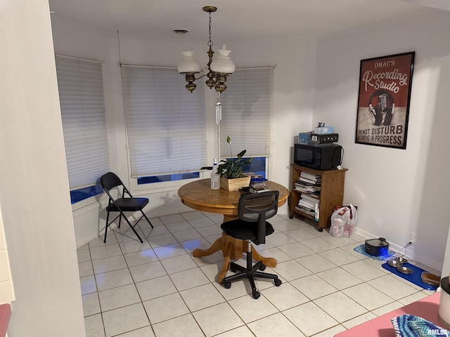 11729 Kevin Ln, Carterville, IL 62918 - dining area with a chandelier and light tile patterned floors