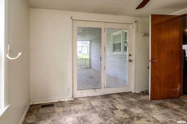 1104 Barham Ave, Johnston City, IL 62951 - entryway with stone finish floors, a ceiling fan, and baseboards