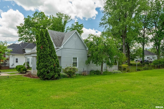 1104 Barham Ave, Johnston City, IL 62951 - view of home's exterior featuring a shingled roof