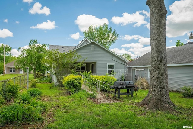 1104 Barham Ave, Johnston City, IL 62951 - back of house with roof with shingles