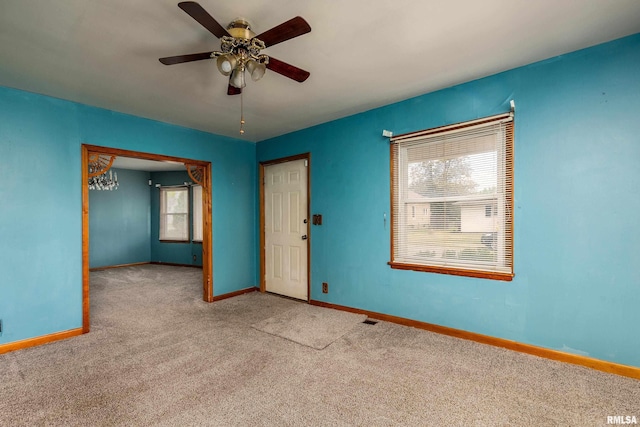 1104 Barham Ave, Johnston City, IL 62951 - carpeted spare room featuring baseboards and ceiling fan