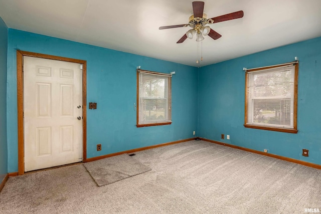 1104 Barham Ave, Johnston City, IL 62951 - unfurnished room with carpet floors, baseboards, and ceiling fan