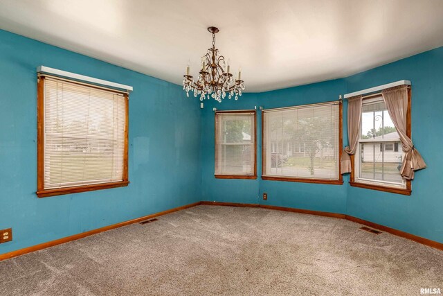 1104 Barham Ave, Johnston City, IL 62951 - unfurnished room with a chandelier, carpet flooring, and baseboards