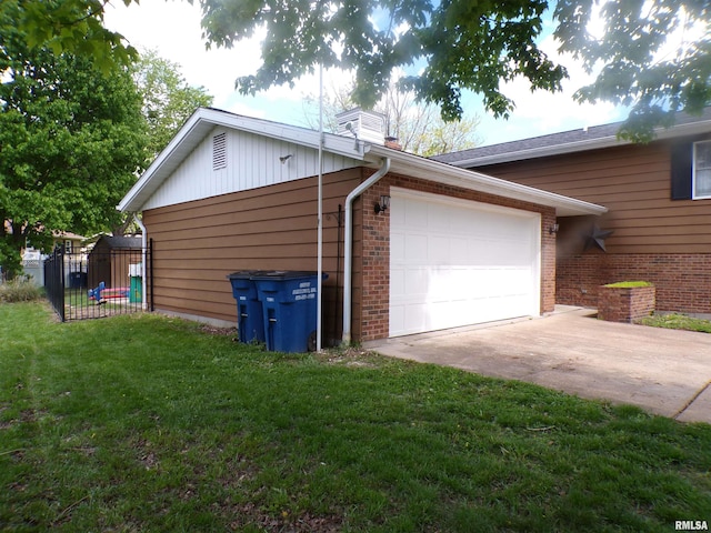 275 Prairie Ln, Sparta, IL 62286 - view of side of home with brick siding, driveway, a garage, a lawn, and a chimney