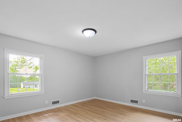 802 W Main St, Vienna, IL 62995 - unfurnished room featuring healthy amount of natural light, light wood-type flooring, and baseboards