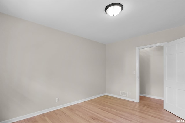 802 W Main St, Vienna, IL 62995 - empty room with light wood-style floors and baseboards