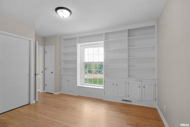 802 W Main St, Vienna, IL 62995 - unfurnished bedroom featuring light wood finished floors and baseboards