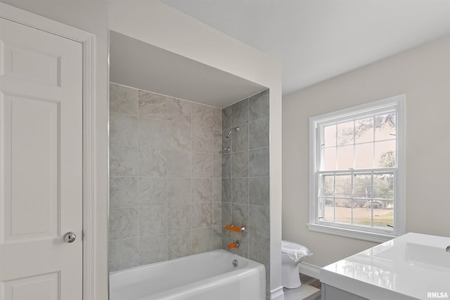 802 W Main St, Vienna, IL 62995 - full bath featuring bathing tub / shower combination, vanity, baseboards, and wood finished floors