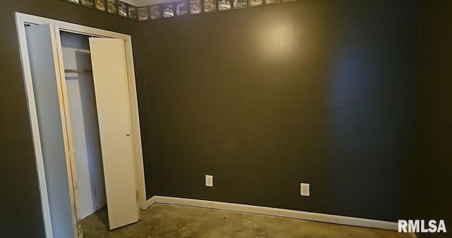 90 Carlock Rd, Murphysboro, IL 62966 - unfurnished bedroom with unfinished concrete flooring and baseboards