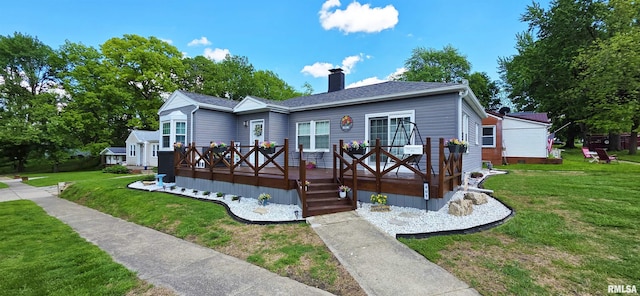 401 E 5th St, Mount Carmel, IL 62863 - view of front of house featuring a chimney, a front yard, and a wooden deck