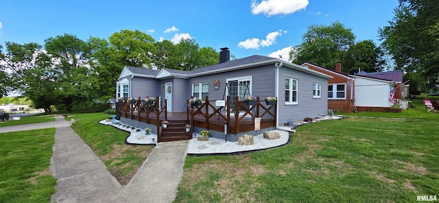 401 E 5th St, Mount Carmel, IL 62863 - view of front of property with a front yard, a chimney, and a deck