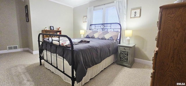 401 E 5th St, Mount Carmel, IL 62863 - bedroom featuring crown molding, light carpet, and baseboards