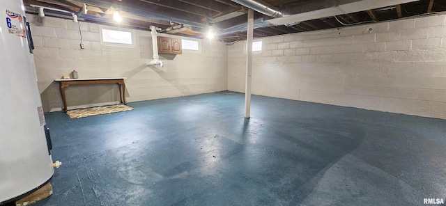 401 E 5th St, Mount Carmel, IL 62863 - basement featuring water heater and concrete block wall