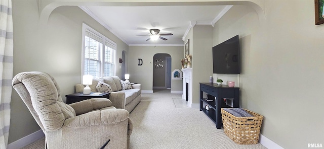 401 E 5th St, Mount Carmel, IL 62863 - living room featuring arched walkways, light colored carpet, ornamental molding, baseboards, and ceiling fan