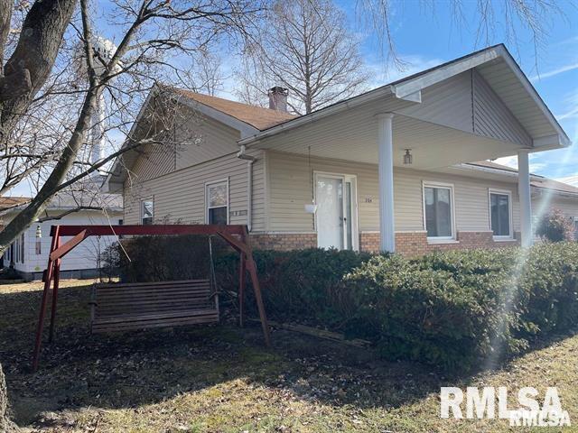 204 W Gelston St, Valier, IL 62891 - view of side of property featuring brick siding and a chimney