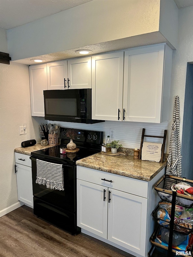 405 E Saint Louis St, West Frankfort, IL 62896 - kitchen with black appliances, dark wood-style floors, white cabinets, a textured wall, and baseboards